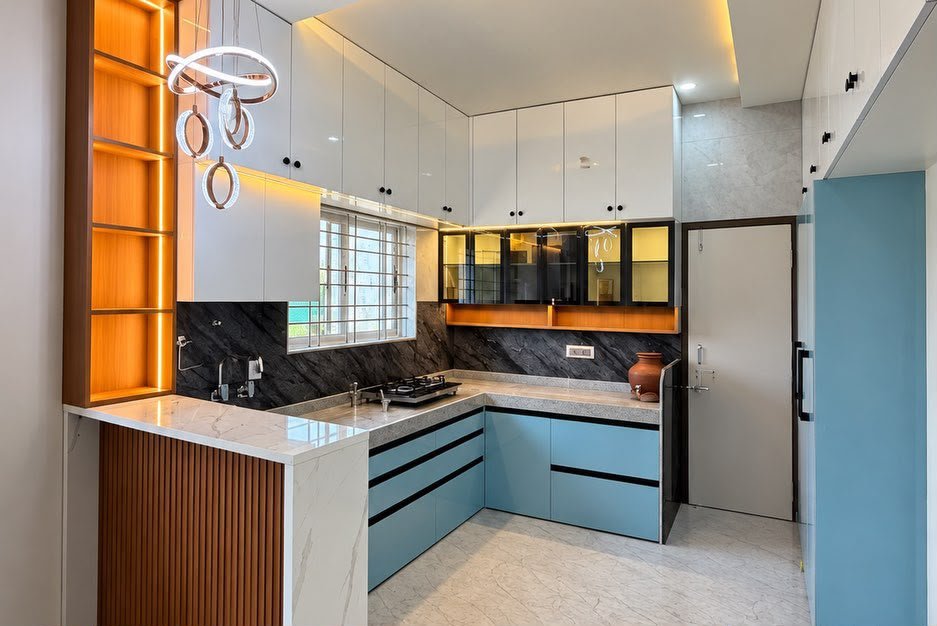 Blue and white L-shaped modular kitchen